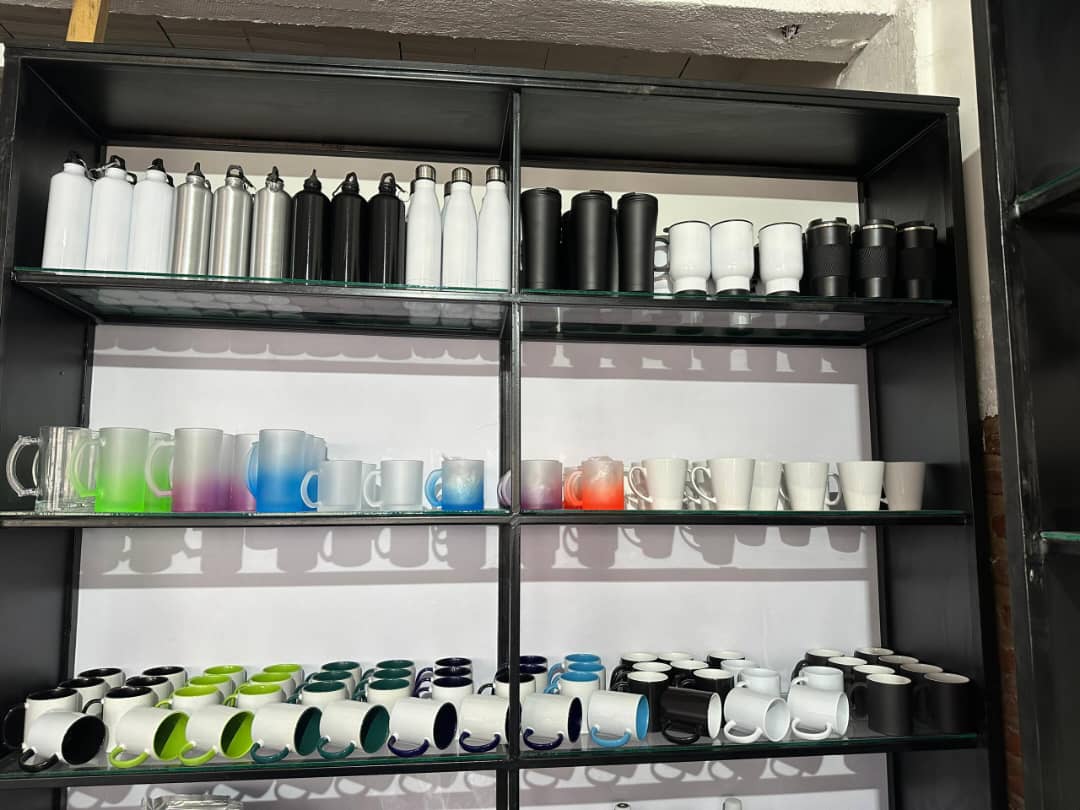 Full Display Shelf of Sublimation Mugs and Bottles – Assorted Styles - Design & Printing Company Product from Digital Canvas